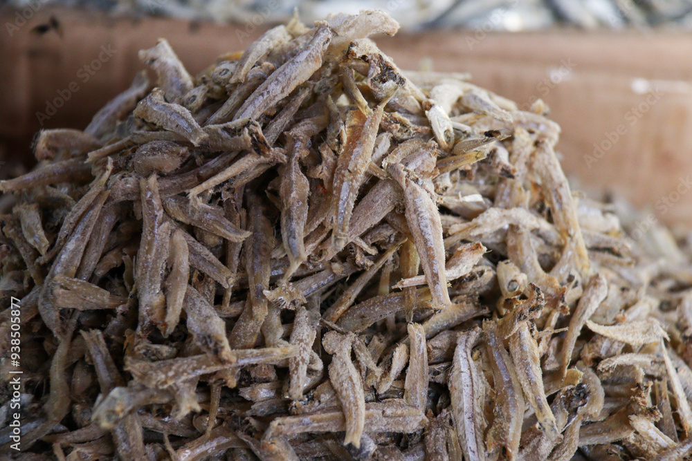 A detailed close-up of dried anchovies piled together, highlighting their texture and readiness for cooking or commercial sale. Perfect for Food and Drink and Agriculture categories A detailed close-up of dried anchovies piled together, highlighting their texture and readiness for cooking or commercial sale. Perfect for Food and Drink and Agriculture categories