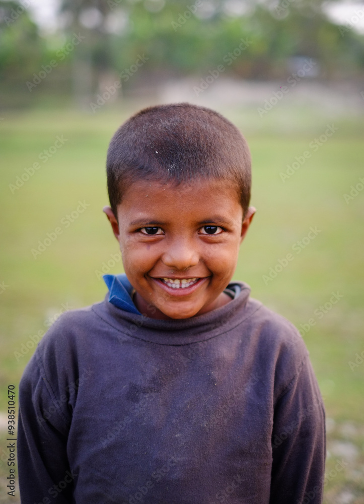 Smiling portrait of a south asian young little rural boy Smiling portrait of a south asian young little rural boy