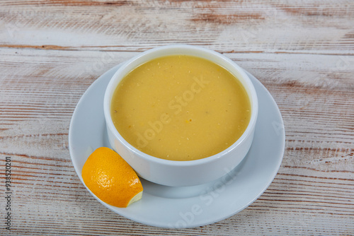 Turkish cuisine Lentil soup, melted butter and red pepper sauce. Served with bread and lemon. Local name; suzme mercimek corbasi.