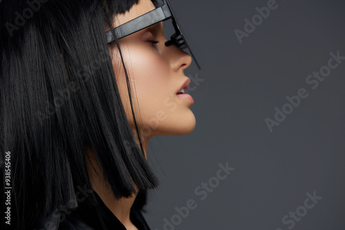 Woman with long black hair wearing smart glasses on her head, looking away from camera, d photo