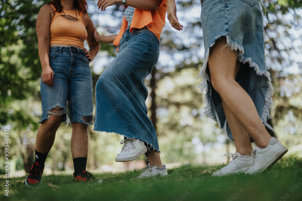 Fototapeta premium Young teenagers enjoying their time together in the park, showcasing their friendship and joy with moments of laughter and happiness.