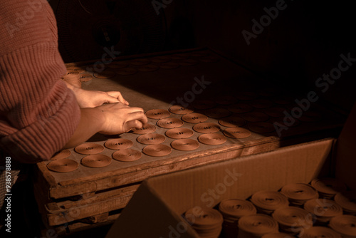 Incense coils are traditionally used as sacrificial objects in temples in Asian countries and can also be used at home. The picture shows the production process