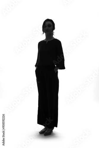 Canvastavla Full-body silhouette of a Caucasian female business person standing in front of