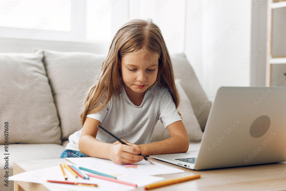 Young girl engaged in creative online learning, sitting at a table with laptop and colorful pencils Young girl engaged in creative online learning, sitting at a table with laptop and colorful pencils