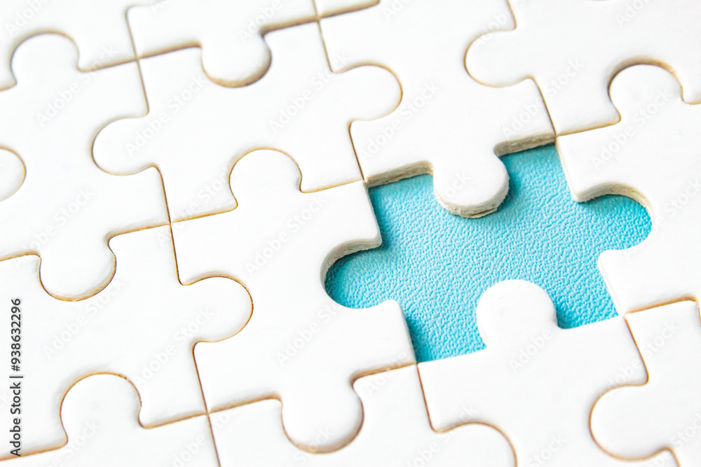 close-up of a missing jigsaw puzzle piece close-up of a missing jigsaw puzzle piece