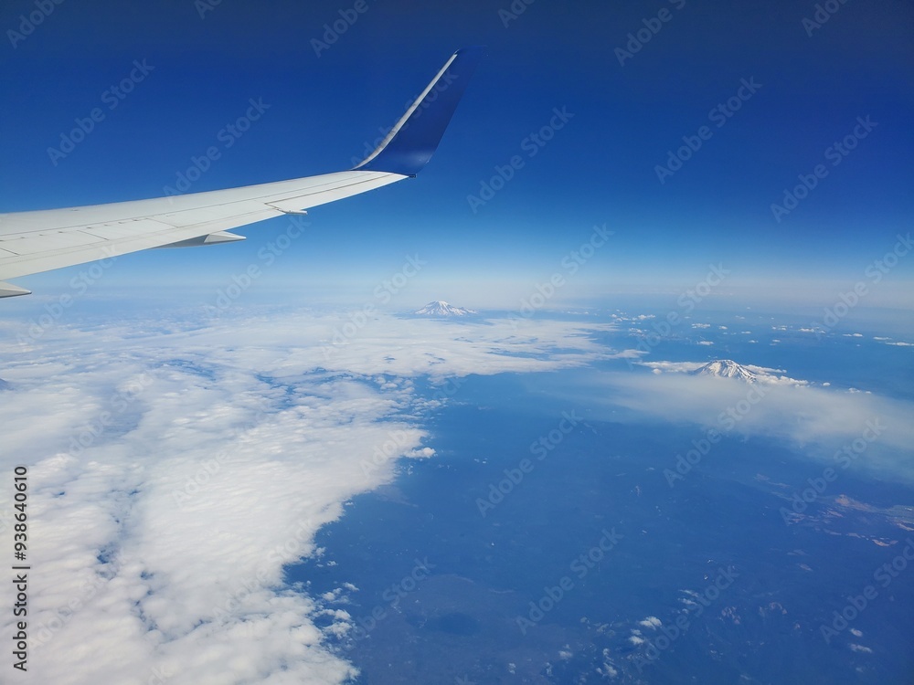 Airplane Flying With A Tall Mountain In Sight Airplane Flying With A Tall Mountain In Sight