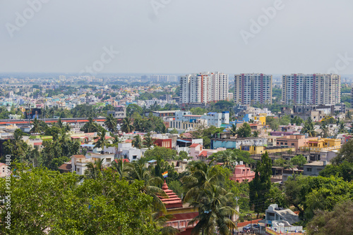 Fototapeta Naklejka Na Ścianę i Meble -  Aerial drone cityscape of bhubaneswar city in odisha. Trees and high rise buildings are seen in the city of temples.