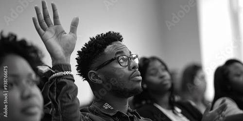 man raising his hand in class photo