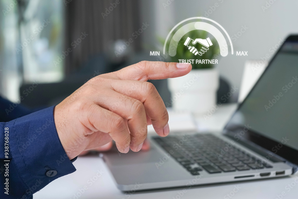 Fototapeta premium Trusted partner. Trustworthy collaboration, company or contract. Confidence to work together. Businessman turning knob to highest trust levels. Build trust in business and finance relationships.