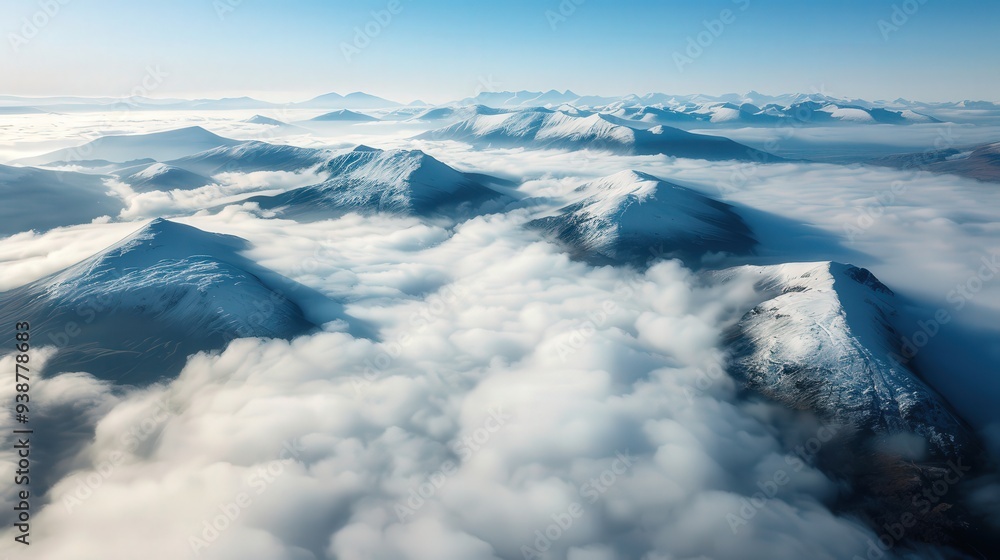 the serene beauty of aerial clouds over a mountain range, where the peaks rise above the cloud layer. the serene beauty of aerial clouds over a mountain range, where the peaks rise above the cloud layer.