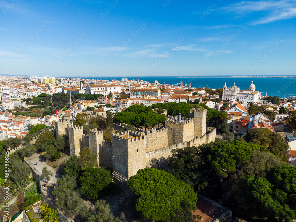 Lisbon, Portugal: Aerial drone view of the Lisbon medieval castle in the old town in Portugal capital city with the Tages river in the background