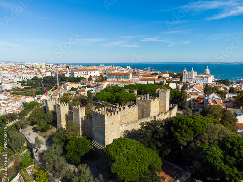 Obraz na płótnie Lisbon, Portugal: Aerial drone view of the Lisbon medieval castle in the old town in Portugal capital city with the Tages river in the background w salonie