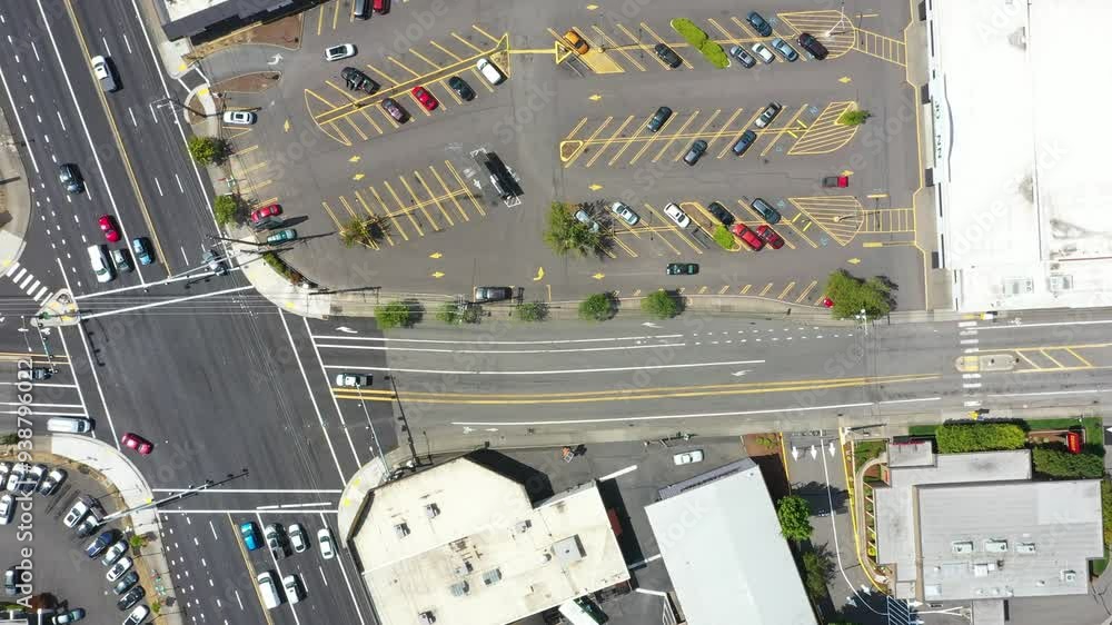 Aerial drone view of a busy car parking lot near shopping centers Aerial drone view of a busy car parking lot near shopping centers