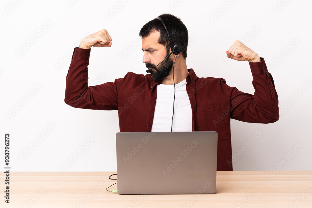 Telemarketer caucasian man working with a headset and with laptop doing strong gesture.