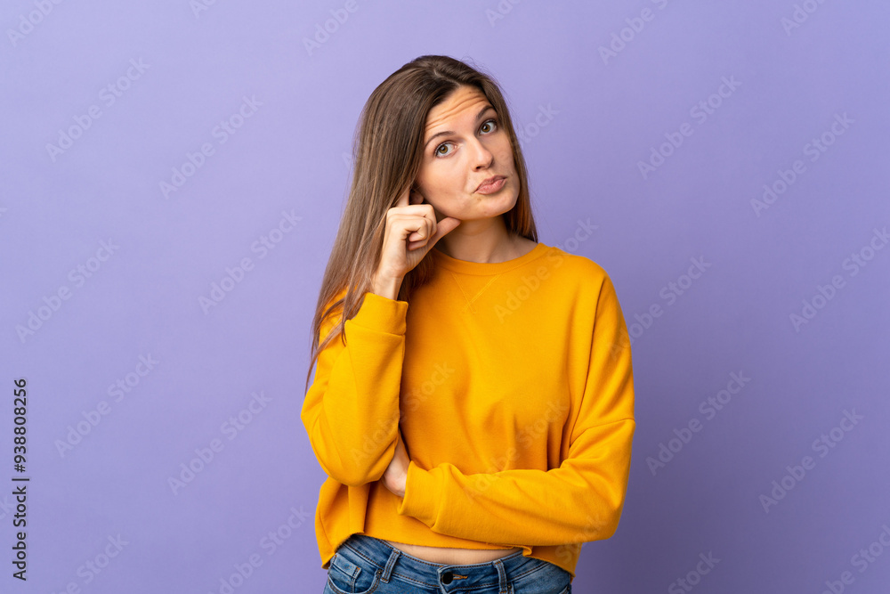 Young Slovak woman isolated on purple background thinking an idea Young Slovak woman isolated on purple background thinking an idea