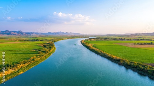 Aerial view of a polluted river, visibly contaminated by pesticides from nearby farmlands.