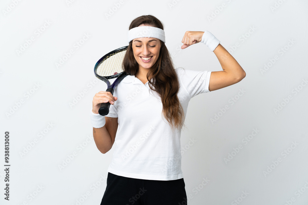 Young woman tennis player over isolated white background doing strong gesture Young woman tennis player over isolated white background doing strong gesture