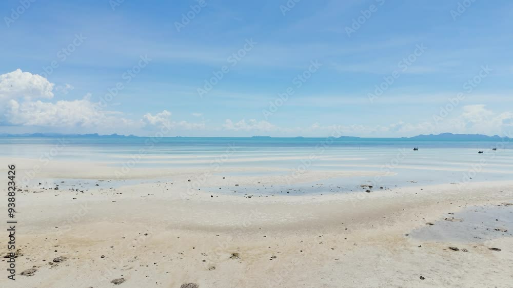 view over beach sea. Tropical shore aerial view, view of waves break on tropical white sand beach. view empty and clean beach. Sea waves seamless loop on the beautiful sand beach. view over beach sea. Tropical shore aerial view, view of waves break on tropical white sand beach. view empty and clean beach. Sea waves seamless loop on the beautiful sand beach.