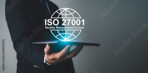 Businessman holding a tablet and showing a symbol ISO 2700, Information security management standard system, ISO 27001 certification security information standard. Requirements, Management, Standards. photo