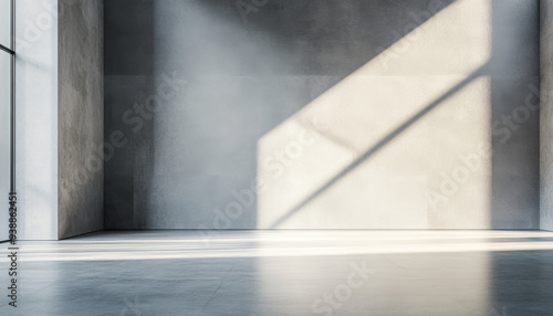 A large empty room with a window that is letting in sunlight. The room is bare and empty, with no furniture or decorations. The sunlight is shining on the floor, creating a bright and empty atmosphere