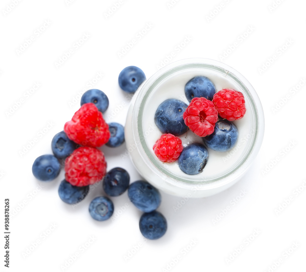 Jar of tasty yogurt with fresh blueberries and raspberries on white background Jar of tasty yogurt with fresh blueberries and raspberries on white background