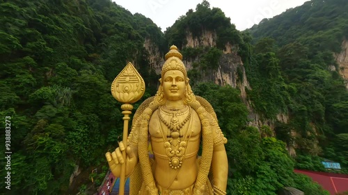 Cinematic FPV shot of Batu Caves and gold statue of Murugan in Kuala Lumpur, Malaysia photo