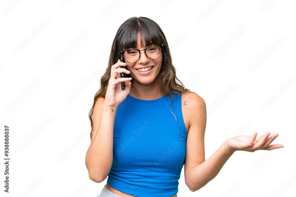 Young caucasian woman over isolated background keeping a conversation with the mobile phone with someone Young caucasian woman over isolated background keeping a conversation with the mobile phone with someone