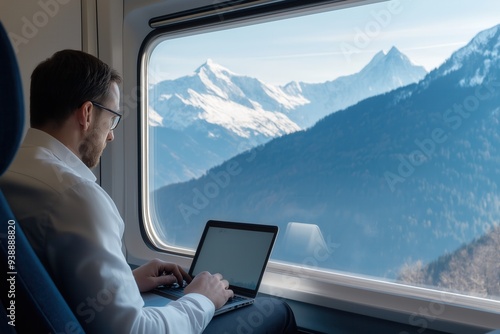Digital Nomad Working on Laptop During Scenic Train Journey