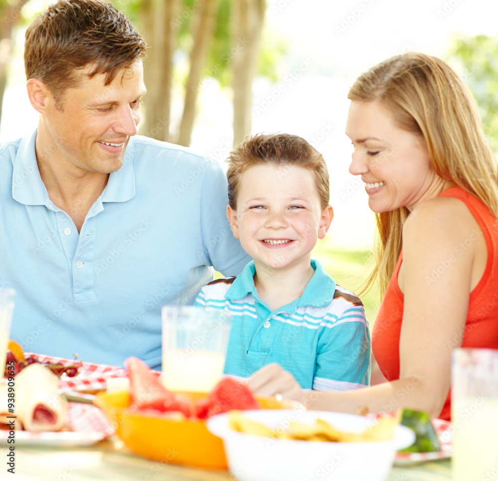Kid, happy family and parents at picnic with food for summer, vacation and thanksgiving party at park. Smile, lunch and people outdoor with mother, father and boy on holiday for celebration together Kid, happy family and parents at picnic with food for summer, vacation and thanksgiving party at park. Smile, lunch and people outdoor with mother, father and boy on holiday for celebration together