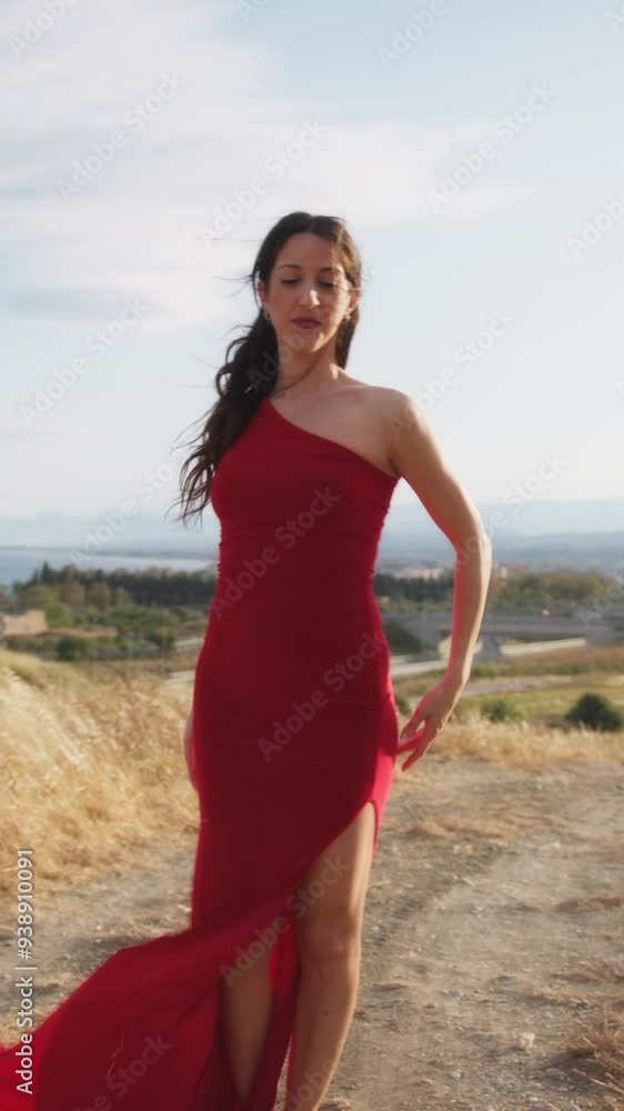 Young Woman Dancer In Elegant Red Dress Dances In Nature To The Wind Of Calabria Young Woman Dancer In Elegant Red Dress Dances In Nature To The Wind Of Calabria