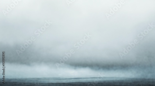 Foggy and overcast seascape with muted tones, creating a serene and mysterious atmosphere.