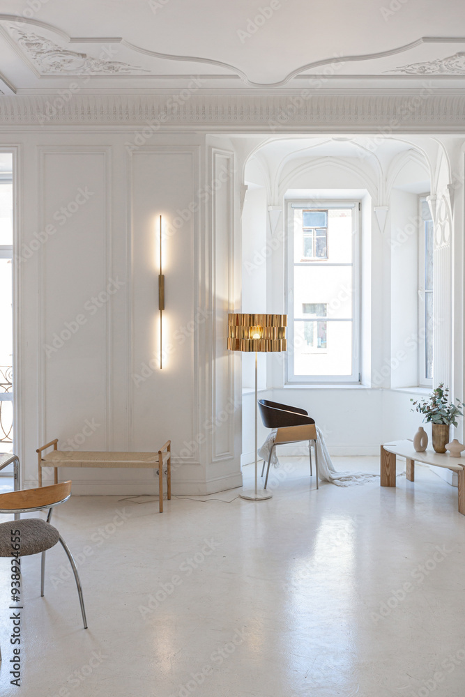 bright interior design of spacious living room with white walls and decorative unique historical moldings on ceiling stylish modern furniture in warm colors without people daylight through the windows bright interior design of spacious living room with white walls and decorative unique historical moldings on ceiling stylish modern furniture in warm colors without people daylight through the windows