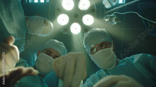 Bottom view of surgeons performing surgery
