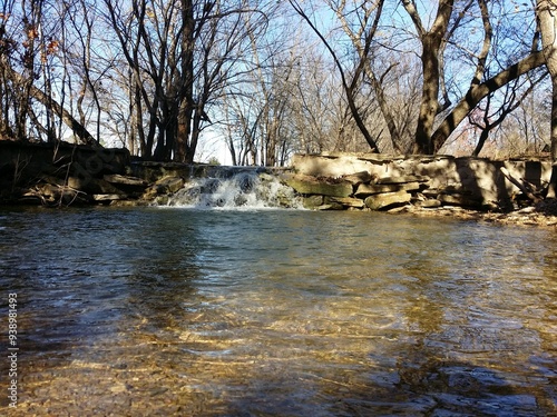 Small Waterfall Over Rocks In Creek photo