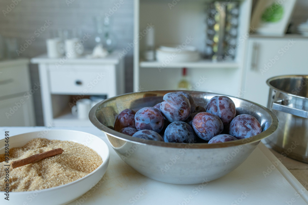 Ingredients for making plum butter or plum jam in the kitchen on a cutting board Ingredients for making plum butter or plum jam in the kitchen on a cutting board