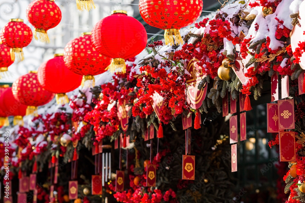 Fototapeta premium Chinese red Christmas lanterns on Tverskaya Street in Moscow. Close-up. The first ever meeting of the Chinese New Year 2024 in Moscow.