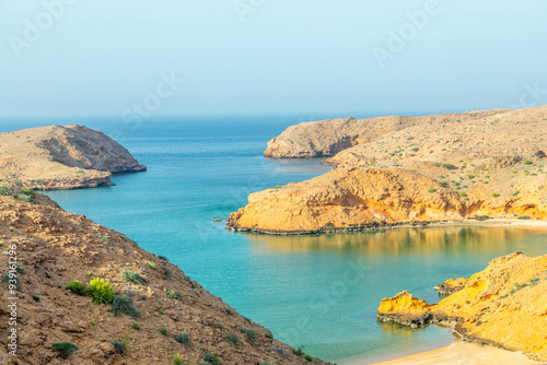 Bandar Al Khairan omani fjord lagoon with sandy beaches, islands and mountains , Muscat, Oman photo