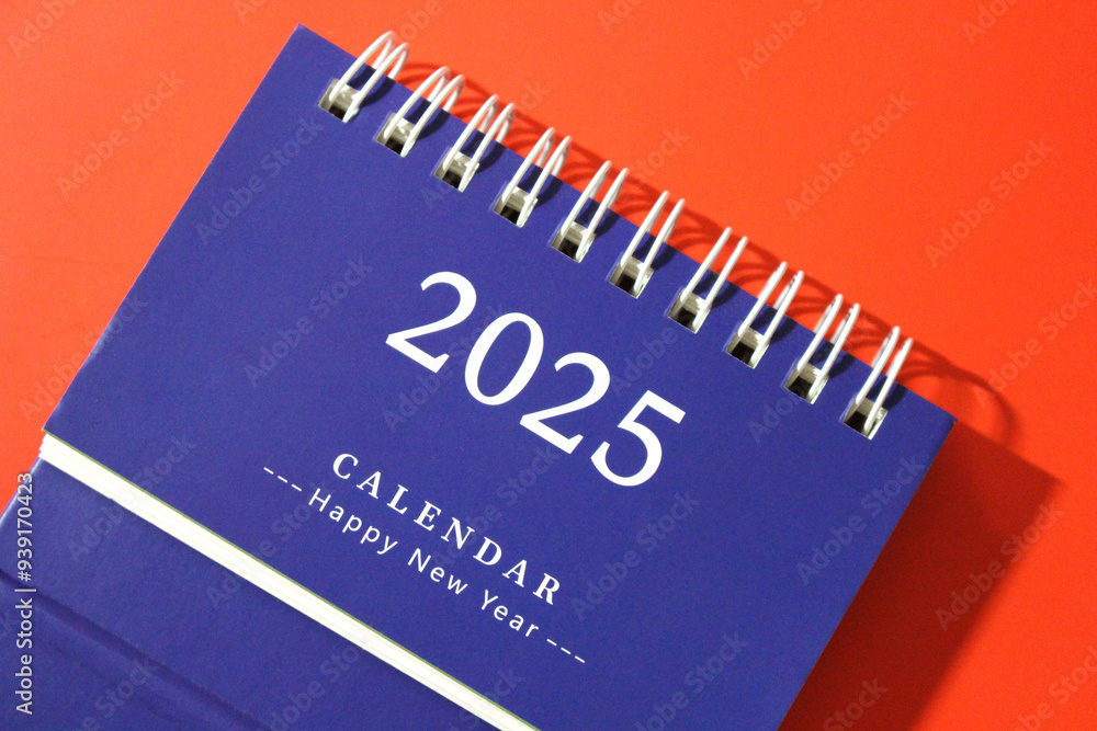 Monthly calendar template for the new year 2025 desk calendar,on red background. Monthly calendar template for the new year 2025 desk calendar,on red background.
