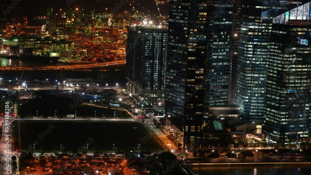 A city skyline at night with many tall buildings lit up. Scene is one of excitement and energy, as the city is bustling with activity even after dark A city skyline at night with many tall buildings lit up. Scene is one of excitement and energy, as the city is bustling with activity even after dark