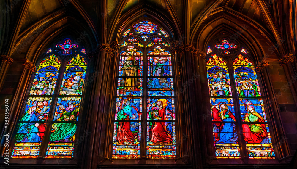 Vivid stained glass window depicting an ancient mythological scene, casting colorful light inside a dimly lit cathedral. Vivid stained glass window depicting an ancient mythological scene, casting colorful light inside a dimly lit cathedral.