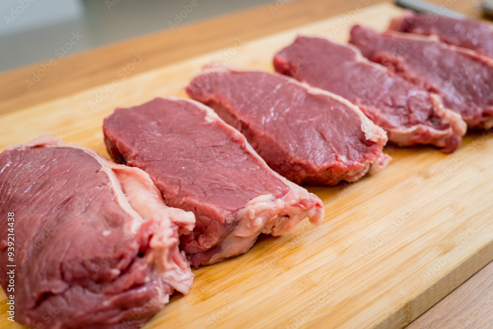 Raw fillet beef meat for steaks on the cutting board Raw fillet beef meat for steaks on the cutting board