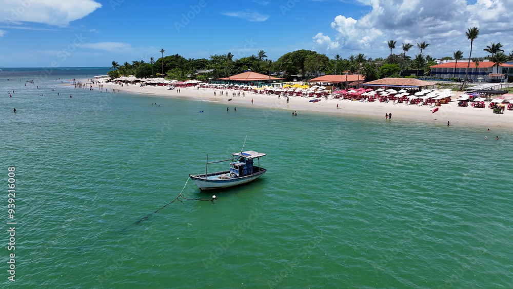 Fototapeta premium Boat Sailing In Santa Cruz Cabralia Bahia Brazil. Idyllic Beach. Nature Landscape. Bahia Brazil. Tourism Background. Boat Sailing In Santa Cruz Cabralia Bahia. Brazil Discovery Coast.