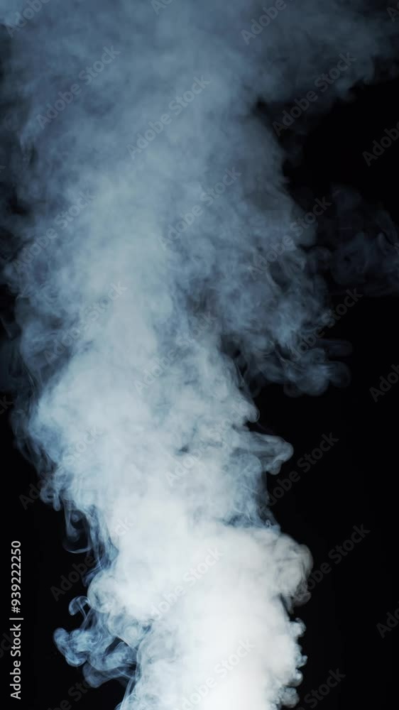 Smoke over black background. Fog or steam abstract dark texture pattern. Vertical, black background. Smoke over black background. Fog or steam abstract dark texture pattern. Vertical, black background.