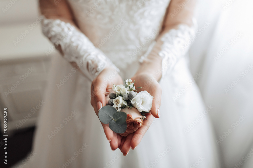 A woman is holding a bouquet of flowers in her hands. The flowers are white and green, and they are arranged in a way that makes them look like they are blooming A woman is holding a bouquet of flowers in her hands. The flowers are white and green, and they are arranged in a way that makes them look like they are blooming