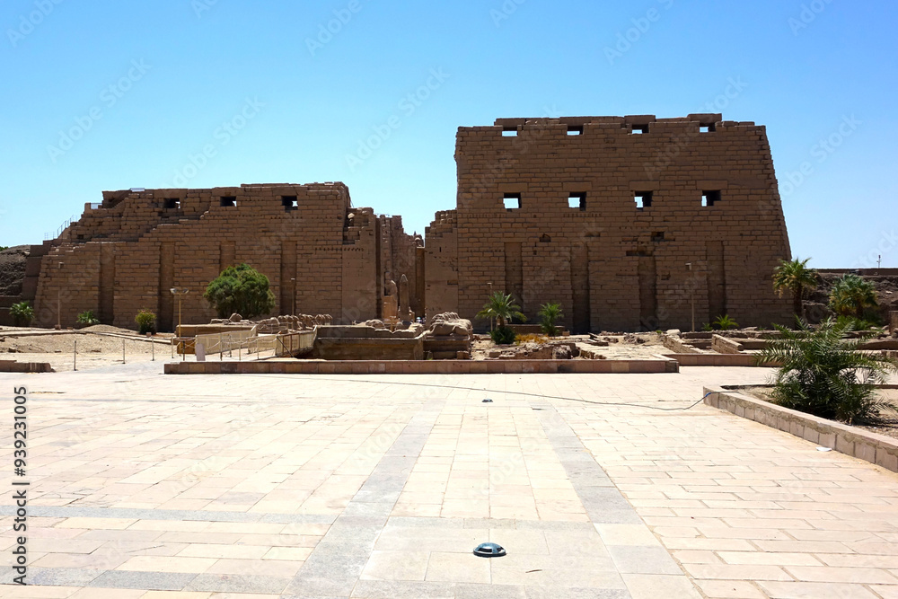 Exploring the Ancient Ruins of the Karnak Temple Complex in Egypt Under a Clear Blue Sky Exploring the Ancient Ruins of the Karnak Temple Complex in Egypt Under a Clear Blue Sky