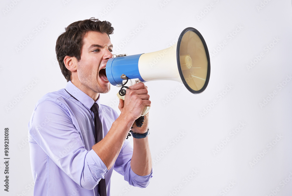 Businessman, upset and megaphone in studio for communication, announcement and breaking news. Employee, angry and loudspeaker on white background for broadcast, noise and corporate propaganda protest Businessman, upset and megaphone in studio for communication, announcement and breaking news. Employee, angry and loudspeaker on white background for broadcast, noise and corporate propaganda protest