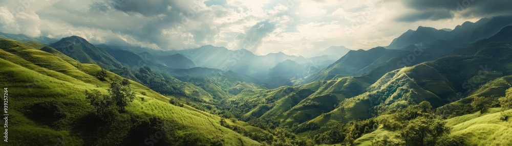 Breathtaking panoramic view of lush green mountains under a dramatic sky, showcasing nature's serene beauty and vibrant colors. Breathtaking panoramic view of lush green mountains under a dramatic sky, showcasing nature's serene beauty and vibrant colors.