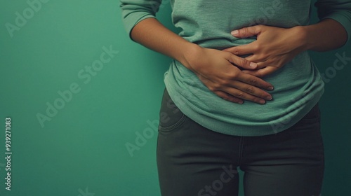 Understanding Stomach Ache: Causes, Symptoms, and Management | Illustration of Abdominal Pain from Indigestion on Green Background photo