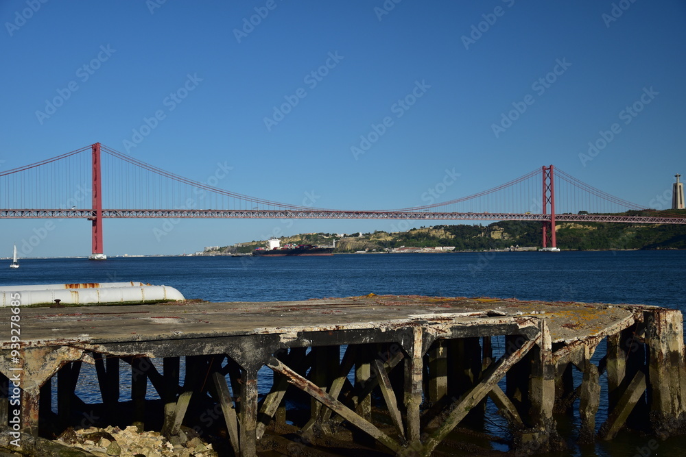 Obraz premium Suspension bridge crossing the river Tagus in Lisbon Portugal. The 25 de Abril Bridge.