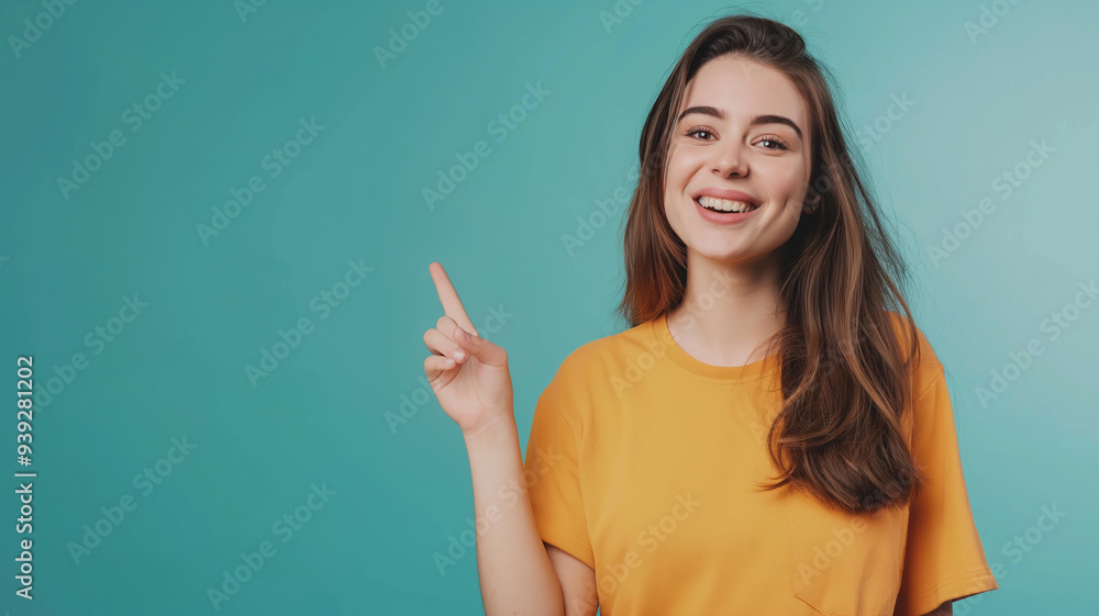 Young caucasian woman pointing a copy space isolated on turquoise background Young caucasian woman pointing a copy space isolated on turquoise background